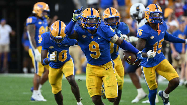 Sep 14, 2024; Pittsburgh, Pennsylvania, USA; Pittsburgh Panthers linebacker Kyle Louis celebrates after intercepting West Virginia Mountaineers quarterback Garrett Greene (6) in the fourth quarter at Acrisure Stadium. Mandatory Credit: Barry Reeger-Image Images