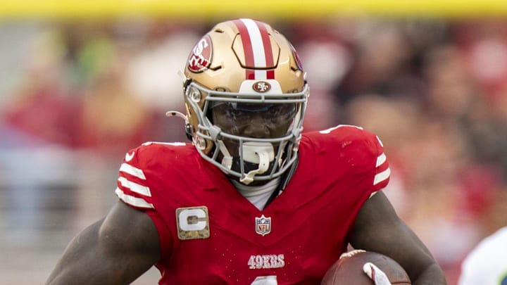 November 17, 2024; Santa Clara, California, USA; San Francisco 49ers wide receiver Deebo Samuel Sr. (1) runs the football against Seattle Seahawks safety Julian Love (20) during the fourth quarter at Levi's Stadium. Mandatory Credit: Kyle Terada-Imagn Images