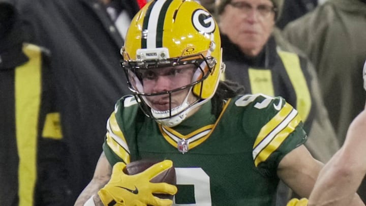 Green Bay Packers wide receiver Christian Watson (9) makes a reception for a first down against the Eagles. Green Bay Packers wide receiver Christian Watson (9) makes a reception for a first down against the Eagles.
