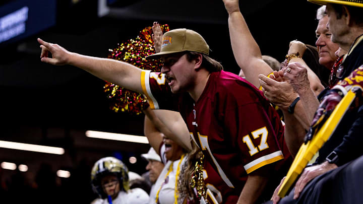 Dec 15, 2024; New Orleans, Louisiana, USA; Washington Commanders fan reacts to a New Orleans Saints failed attempt on a two point conversion as time expires at Caesars Superdome. Mandatory Credit: Stephen Lew-Imagn Images Dec 15, 2024; New Orleans, Louisiana, USA; Washington Commanders fan reacts to a New Orleans Saints failed attempt on a two point conversion as time expires at Caesars Superdome. Mandatory Credit: Stephen Lew-Imagn Images