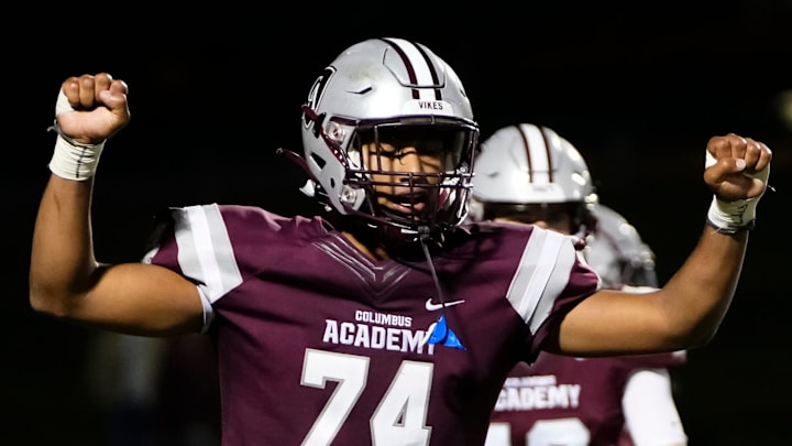 Sep 14, 2023; Gahanna, Ohio, USA; Columbus Academy defensive lineman Reinaldo Perez (74) celebrates the 23-16 win over St. Charles during the high school football game at Columbus Academy.