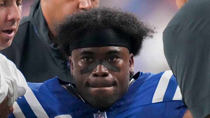 Indianapolis Colts cornerback Kenny Moore is helped to his feet