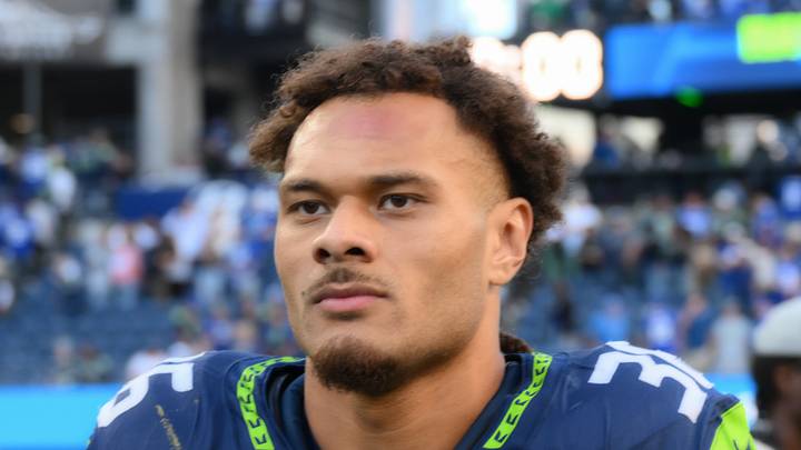 Seattle Seahawks running back George Holani walks off the field
