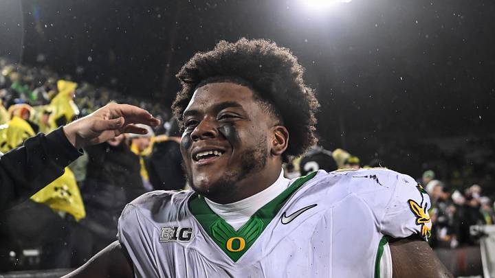 Nov 8, 2025; Iowa City, Iowa, USA; Oregon Ducks defensive lineman A'Mauri Washington (52) reacts with fans after the game against the Iowa Hawkeyes at Kinnick Stadium. Nov 8, 2025; Iowa City, Iowa, USA; Oregon Ducks defensive lineman A'Mauri Washington (52) reacts with fans after the game against the Iowa Hawkeyes at Kinnick Stadium.
