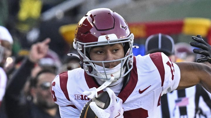 Nov 22, 2025; Eugene, Oregon, USA; Southern California Trojans wide receiver Tanook Hines (16) runs with the ball during the first half against the Oregon Ducks at Autzen Stadium. Mandatory Credit: Troy Wayrynen-Imagn Images Nov 22, 2025; Eugene, Oregon, USA; Southern California Trojans wide receiver Tanook Hines (16) runs with the ball during the first half against the Oregon Ducks at Autzen Stadium. Mandatory Credit: Troy Wayrynen-Imagn Images
