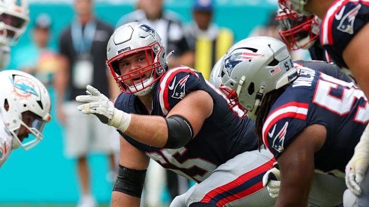 Sep 14, 2025; Miami Gardens, Florida, USA; New England Patriots center Garrett Bradbury (65) lines up against the Miami Dolphins in the fourth quarter at Hard Rock Stadium. Mandatory Credit: Nathan Ray Seebeck-Imagn Images