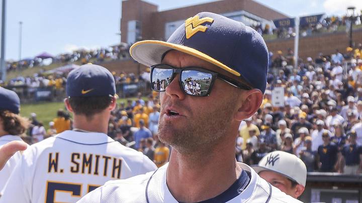 Jun 5, 2026; Morgantown, WV, USA; West Virginia Mountaineers head coach Steve Sabins celebrates with his team after defeating the Cal Poly Mustangs at Kendrick Family Ballpark. Mandatory Credit: Ben Queen-Imagn Images Jun 5, 2026; Morgantown, WV, USA; West Virginia Mountaineers head coach Steve Sabins celebrates with his team after defeating the Cal Poly Mustangs at Kendrick Family Ballpark. Mandatory Credit: Ben Queen-Imagn Images