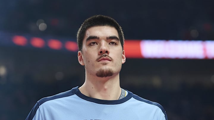 Mar 19, 2025; Portland, Oregon, USA; Memphis Grizzlies center Zach Edey (14) high fives teammates during introductions before a game against the Portland Trail Blazers at Moda Center. Mandatory Credit: Troy Wayrynen-Imagn Images