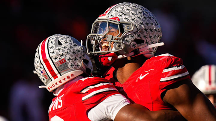 Ohio State Buckeyes S Caleb Downs celebrates with LB Sonny Styles after sacking Rutgers Scarlet Knights QB Athan Kaliakmanis.