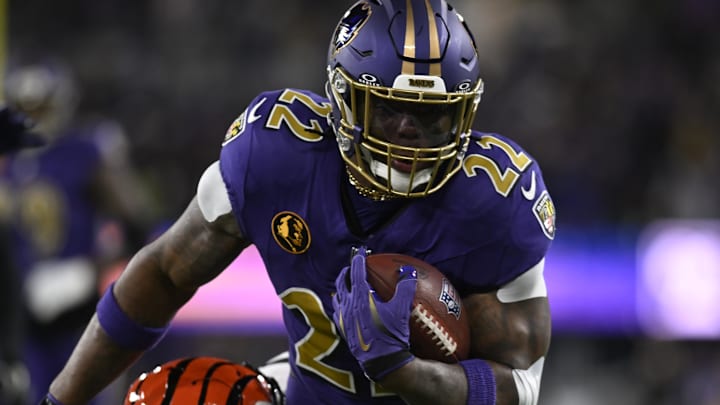 Nov 27, 2025; Baltimore, Maryland, USA; Baltimore Ravens running back Derrick Henry (22) rushes the ball against the Cincinnati Bengals during the first half at M&T Bank Stadium. 