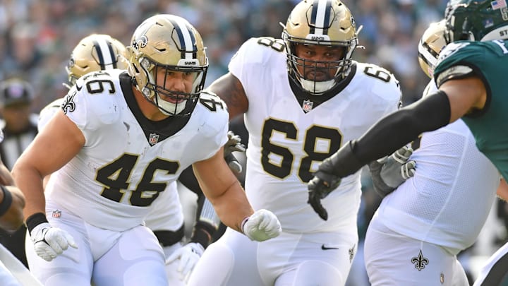 Jan 1, 2023; Philadelphia, Pennsylvania, USA; New Orleans Saints fullback Adam Prentice (46) and guard Josh Andrews (68) against the Philadelphia Eagles at Lincoln Financial Field.