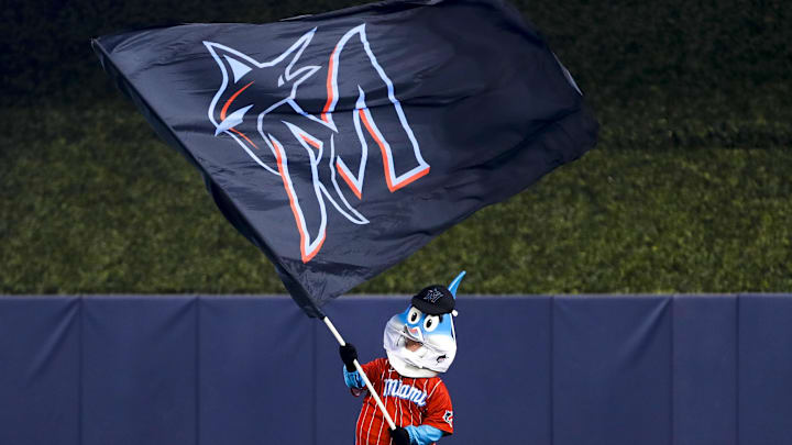 Jul 11, 2021; Miami, Florida, USA; Miami Marlins mascot Billy the Marlin waves a Miami Marlins flag after winning the game against the Atlanta Braves at loanDepot Park. Mandatory Credit: Sam Navarro-Imagn Images