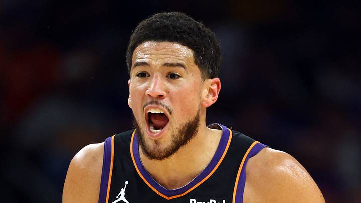 Phoenix Suns guard Devin Booker (1) reacts against the Golden State Warriors during the first half in the play-in rounds of the 2026 NBA Playoffs at Mortgage Matchup Center on April 17, 2026. Phoenix Suns guard Devin Booker (1) reacts against the Golden State Warriors during the first half in the play-in rounds of the 2026 NBA Playoffs at Mortgage Matchup Center on April 17, 2026.