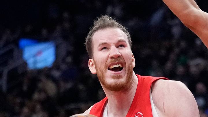 Boston Celtics guard Derrick White defends Toronto Raptors center Jakob Poeltl. Boston Celtics guard Derrick White defends Toronto Raptors center Jakob Poeltl.