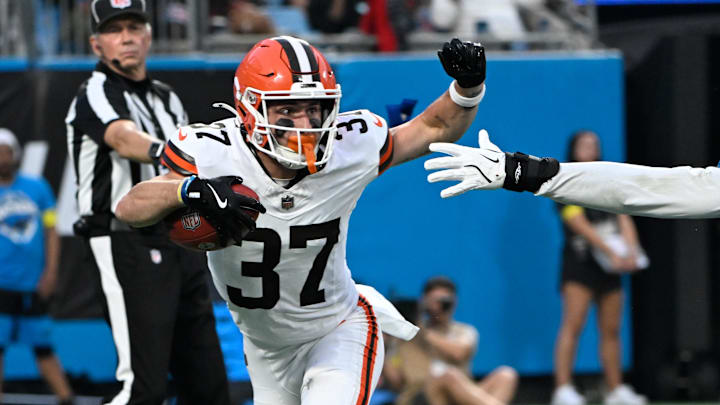 Aug 8, 2025; Charlotte, North Carolina, USA; DUPLICATE***Cleveland Browns wide receiver Luke Floriea (37)***Cleveland Browns cornerback Dom Jones (37) with the ball as Carolina Panthers wide receiver Brycen Tremayne (87) defends in the second quarter at Bank of America Stadium. Mandatory Credit: Bob Donnan-Imagn Images