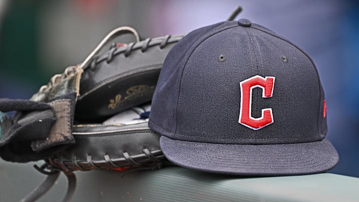 Jun 27, 2024; Kansas City, Missouri, USA; A general view a Cleveland Guardians hat and glove on the dugout railing before a game against the Kansas City Royals at Kauffman Stadium. Mandatory Credit: Peter Aiken-Imagn Images Jun 27, 2024; Kansas City, Missouri, USA; A general view a Cleveland Guardians hat and glove on the dugout railing before a game against the Kansas City Royals at Kauffman Stadium. Mandatory Credit: Peter Aiken-Imagn Images