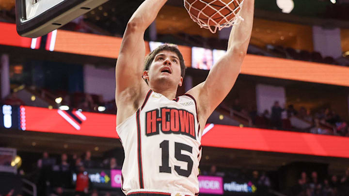 Feb 12, 2025; Houston, Texas, USA; Houston Rockets guard Reed Sheppard (15) dunks against the Phoenix Suns in the second half at Toyota Center. Mandatory Credit: Thomas Shea-Imagn Images