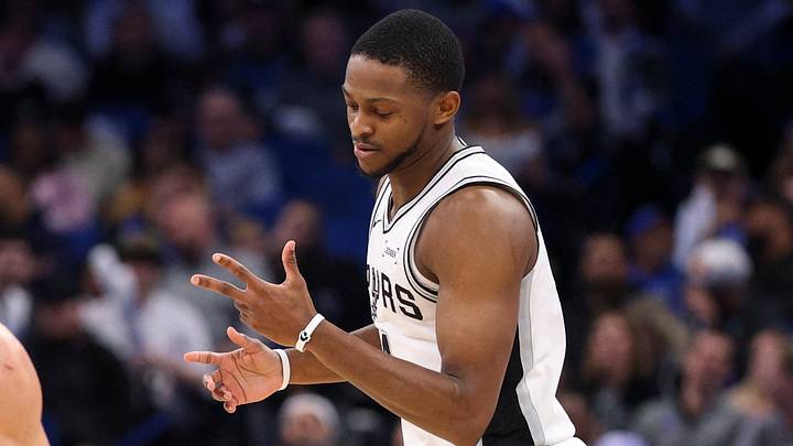 Dec 3, 2025; Orlando, Florida, USA; San Antonio Spurs guard De'Aaron Fox (4) reacts after a three point basket against the Orlando Magic in the fourth quarter at Kia Center. Mandatory Credit: Nathan Ray Seebeck-Imagn Images