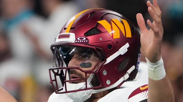 Washington Commanders quarterback Marcus Mariota reacts after a play against the Miami Dolphins. Washington Commanders quarterback Marcus Mariota reacts after a play against the Miami Dolphins.