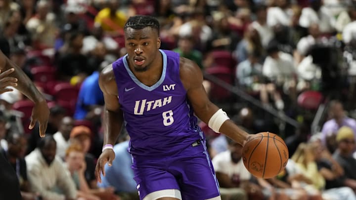 Jul 14, 2025; Las Vegas, NV, USA; Utah Jazz guard Isaiah Collier (8) dribbles the ball against San Antonio Spurs forward David Jones-Garcia (25) during the first half of a NBA basketball game at the Thomas & Mack Center. Mandatory Credit: Lucas Peltier-Imagn Images Jul 14, 2025; Las Vegas, NV, USA; Utah Jazz guard Isaiah Collier (8) dribbles the ball against San Antonio Spurs forward David Jones-Garcia (25) during the first half of a NBA basketball game at the Thomas & Mack Center. Mandatory Credit: Lucas Peltier-Imagn Images