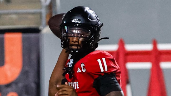 Sep 27, 2025; Raleigh, North Carolina, USA; North Carolina State Wolfpack quarterback CJ Bailey (11) throws the football during the first half of the game against Virginia Tech Hokies at Carter-Finley Stadium. Mandatory Credit: Jaylynn Nash-Imagn Images Sep 27, 2025; Raleigh, North Carolina, USA; North Carolina State Wolfpack quarterback CJ Bailey (11) throws the football during the first half of the game against Virginia Tech Hokies at Carter-Finley Stadium. Mandatory Credit: Jaylynn Nash-Imagn Images
