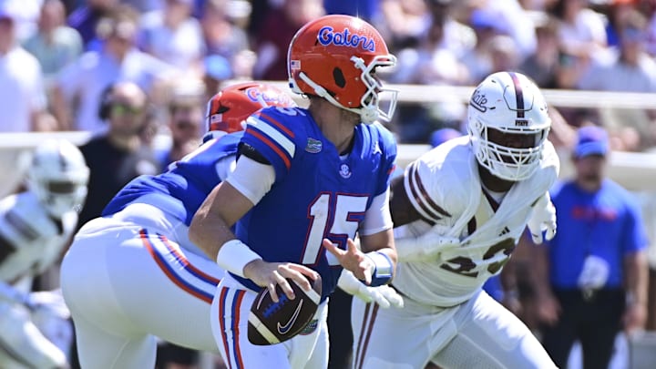 Sep 21, 2024; Starkville, Mississippi, USA; Florida Gators quarterback Graham Mertz (15) rolls out to pass against the Mississippi State Bulldogs during the third quarter at Davis Wade Stadium at Scott Field. Mandatory Credit: Matt Bush-Imagn Images Sep 21, 2024; Starkville, Mississippi, USA; Florida Gators quarterback Graham Mertz (15) rolls out to pass against the Mississippi State Bulldogs during the third quarter at Davis Wade Stadium at Scott Field. Mandatory Credit: Matt Bush-Imagn Images