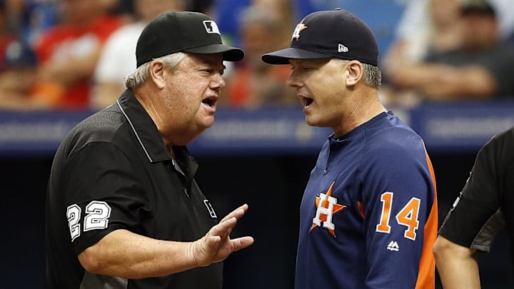 Houston Astros manager A.J. Hinch (14) is ejected by umpire Joe West (22)