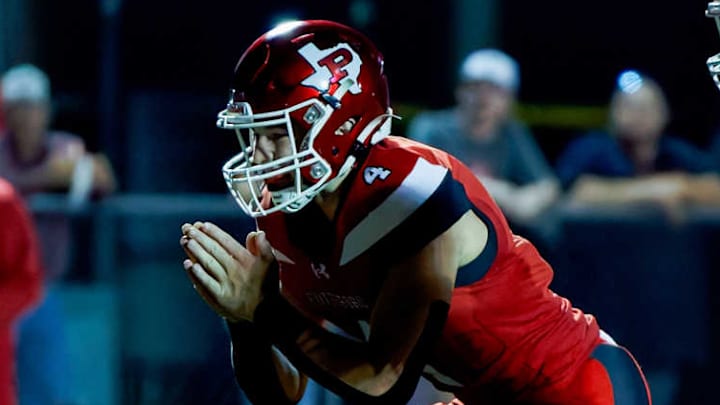 Pottsboro quarterback Cayden Humphrey awaits a snap in a game earlier this season against Muenster. Pottsboro won a Class 3A Division I playoff game that started Nov. 28 and ended early Nov. 29. 