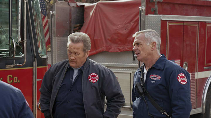 Christian Stolte and David Eigenberg standing together from Chicago Fire - Season 13