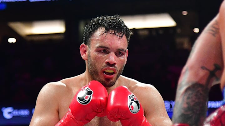 Jun 28, 2025; Anaheim, California, USA; Julio Cesar Chavez Jr. fights against Jake Paul  at Honda Center. Mandatory Credit: Gary A. Vasquez-Imagn Images