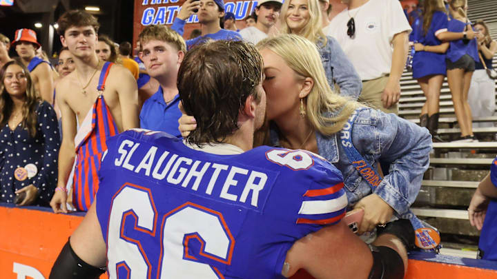 Florida offensive lineman Jake Slaughter (66) gets a hug after an NCAA football game against Tennessee 