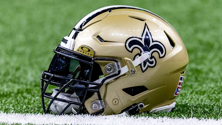 Jan 7, 2024; New Orleans, Louisiana, USA; Detailed view of the New Orleans Saints helmet during warmups against the Atlanta Falcons at Caesars Superdome. Mandatory Credit: Stephen Lew-Imagn Images