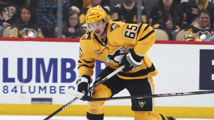 Mar 5, 2026; Pittsburgh, Pennsylvania, USA;  Pittsburgh Penguins defenseman Erik Karlsson (65) moves the puck against Buffalo Sabres center Ryan McLeod (71) during the first period at PPG Paints Arena. Mandatory Credit: Charles LeClaire-Imagn Images