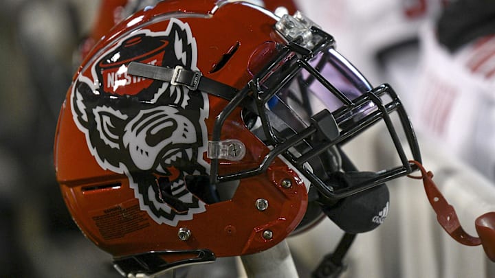 Nov 13, 2021; Winston-Salem, North Carolina, USA; A North Carolina State Wolfpack helmet seen on the sideline during the second half against the Wake Forest Demon Deacons at Truist Field. Mandatory Credit: William Howard-Imagn Images Nov 13, 2021; Winston-Salem, North Carolina, USA; A North Carolina State Wolfpack helmet seen on the sideline during the second half against the Wake Forest Demon Deacons at Truist Field. Mandatory Credit: William Howard-Imagn Images