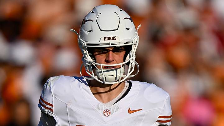 Texas Longhorns quarterback Arch Manning (16) runs back on the field during the game between the Sooners and the Longhorns at Cotton Bowl. 
