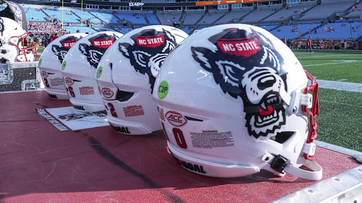 Sep 7, 2024; Charlotte, North Carolina, USA; North Carolina State Wolfpack helmets during pregame activity for the Dukes Mayo Classic against the Tennessee Volunteers at Bank of America Stadium. Mandatory Credit: Jim Dedmon-Imagn Images Sep 7, 2024; Charlotte, North Carolina, USA; North Carolina State Wolfpack helmets during pregame activity for the Dukes Mayo Classic against the Tennessee Volunteers at Bank of America Stadium. Mandatory Credit: Jim Dedmon-Imagn Images