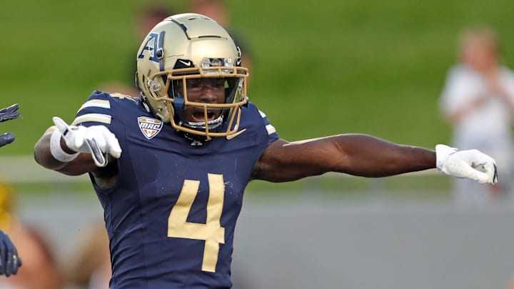 Akron Zips wide receiver Bobby Golden, right, celebrates his first-half touchdown catch against Colgate, Saturday, Sept. 14, 2024.