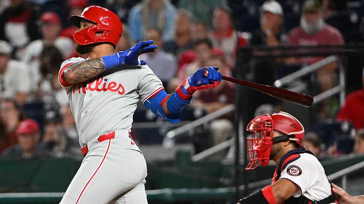 Jun 23, 2026; Washington, District of Columbia, USA; Philadelphia Phillies second baseman Edmundo Sosa (33) hits a two RBI double against the Washington Nationals during the ninth inning at Nationals Park.