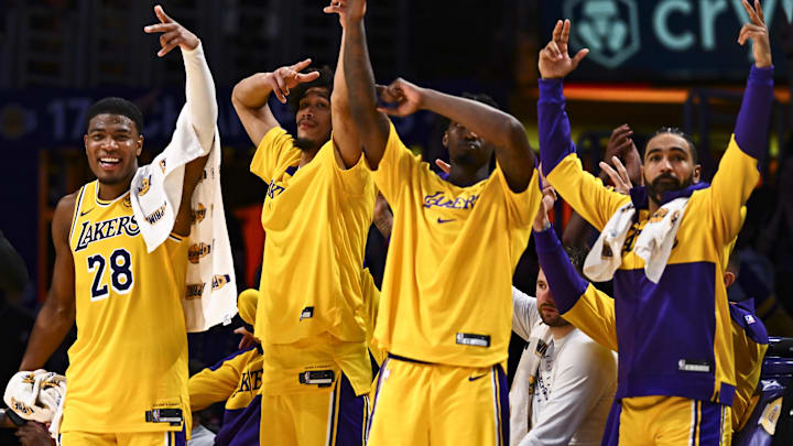 Los Angeles Lakers forward Rui Hachimura (28), center Jaxson Hayes (11), and guard Gabe Vincent (7) celebrate after scoring against the Houston Rockets during the second half at Crypto.com Arena.