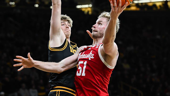 Nebraska forward Rienk Mast (51) goes to the basket against Iowa Hawkeyes forward Cooper Koch (8).