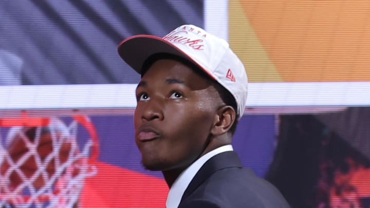 Derik Queen reacts on stage after being selected as the 13th pick by the Atlanta Hawks in the first round of the 2025 NBA Draft at Barclays Center. Queen would be traded to New Orleans shortly after this selection. Derik Queen reacts on stage after being selected as the 13th pick by the Atlanta Hawks in the first round of the 2025 NBA Draft at Barclays Center. Queen would be traded to New Orleans shortly after this selection.