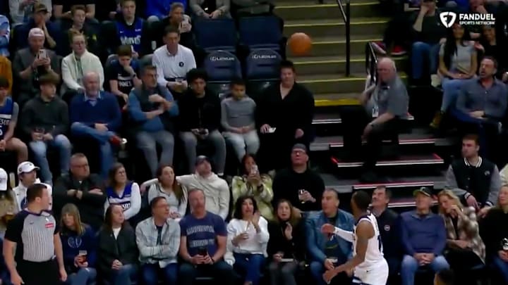 Mike Conley watches a Julius Randle pass sail into the stands. Mike Conley watches a Julius Randle pass sail into the stands.