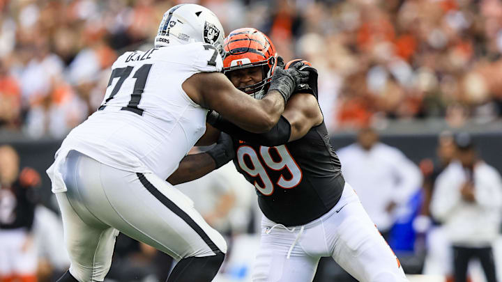 Nov 3, 2024; Cincinnati, Ohio, USA; Las Vegas Raiders offensive tackle DJ Glaze (71) pushes against Cincinnati Bengals defensive end Myles Murphy (99) in the second half at Paycor Stadium. Mandatory Credit: Katie Stratman-Imagn Images