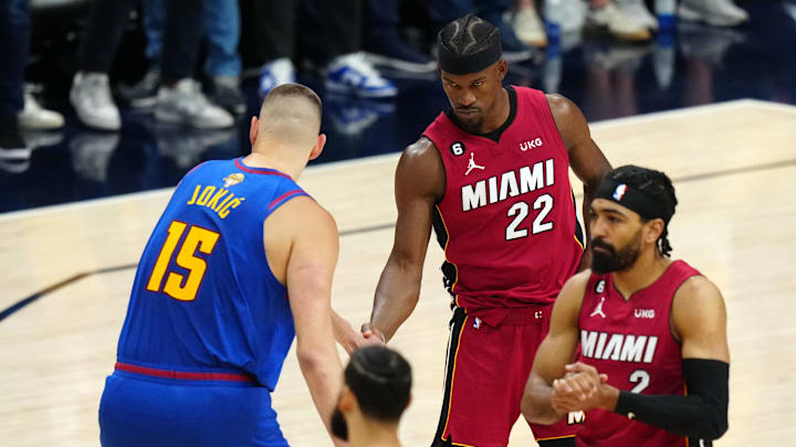 Jun 1, 2023; Denver, CO, USA; Miami Heat forward Jimmy Butler (22) and Denver Nuggets center Nikola Jokic (15) shake hands before the game in game one of the 2023 NBA Finals at Ball Arena. 