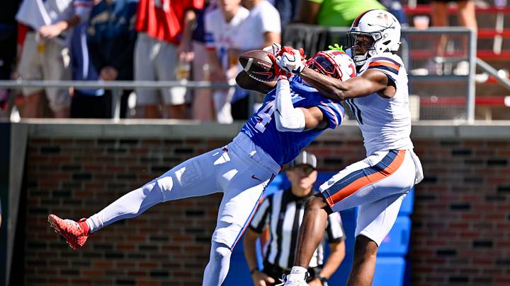 Oct 17, 2026; Dallas, Texas, USA; SMU Mustangs cornerback Jayvon Thomas (4) breaks up a pass intended for Virginia Cavaliers wide receiver Isaiah Robinson (11). Mandatory Credit: Jerome Miron-Imagn Images Oct 17, 2026; Dallas, Texas, USA; SMU Mustangs cornerback Jayvon Thomas (4) breaks up a pass intended for Virginia Cavaliers wide receiver Isaiah Robinson (11). Mandatory Credit: Jerome Miron-Imagn Images