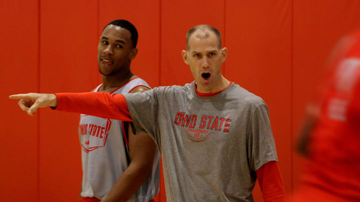 OSU assistant coach Chris Jent encourages players while Jared Sullinger keeps a eye Coach Chris Jent at practice Oct. 19, 2011. (Dispatch photo by Eric Albrecht)