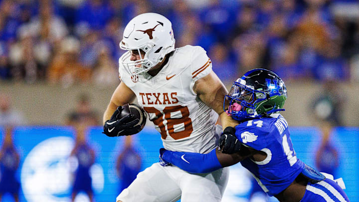 Texas Longhorns tight end Jack Endries is tackled by Kentucky Wildcats defensive back Ty Bryant during the second quarter at Kroger Field.