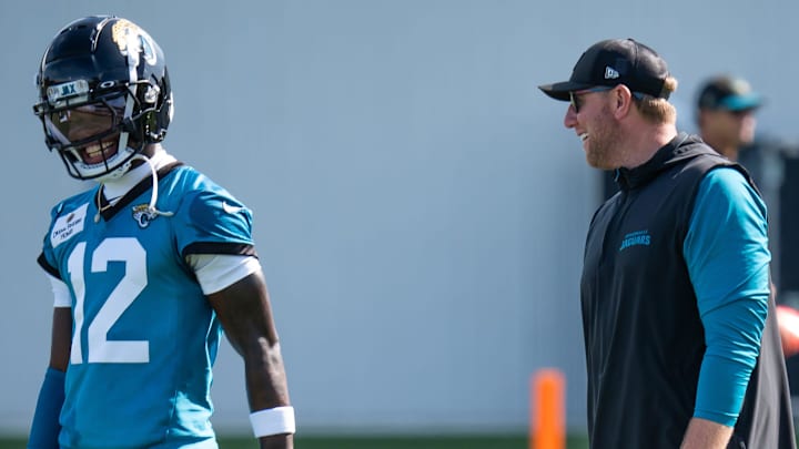 Jacksonville Jaguars wide receiver Travis Hunter (12) has a laugh with Jacksonville Jaguars head coach Liam Coen during the Jacksonville Jaguars’ third mandatory minicamp Thursday June 12, 2025 at the Miller Electric Center in Jacksonville, Fla. [Doug Engle/Florida Times-Union]