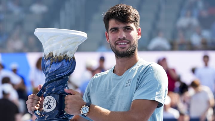 Aug 18, 2025; Cincinnati, OH, USA; Carlos Alcaraz (ESP) poses for a photo with the Rookwood Cup after his match against Jannik Sinner (ITA) during the Cincinnati Open at the Lindner Family Tennis Center. Mandatory Credit: Aaron Doster-Imagn Images Aug 18, 2025; Cincinnati, OH, USA; Carlos Alcaraz (ESP) poses for a photo with the Rookwood Cup after his match against Jannik Sinner (ITA) during the Cincinnati Open at the Lindner Family Tennis Center. Mandatory Credit: Aaron Doster-Imagn Images