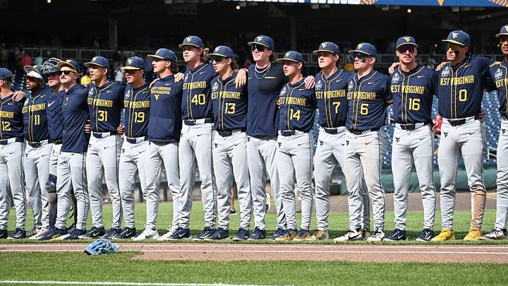Jun 16, 2026; Omaha, NE, USA; West Virginia Mountaineers players celebrate singing Country Roads after the win against the Troy Trojans at Charles Schwab Field. Mandatory Credit: Steven Branscombe-Imagn Images Jun 16, 2026; Omaha, NE, USA; West Virginia Mountaineers players celebrate singing Country Roads after the win against the Troy Trojans at Charles Schwab Field. Mandatory Credit: Steven Branscombe-Imagn Images